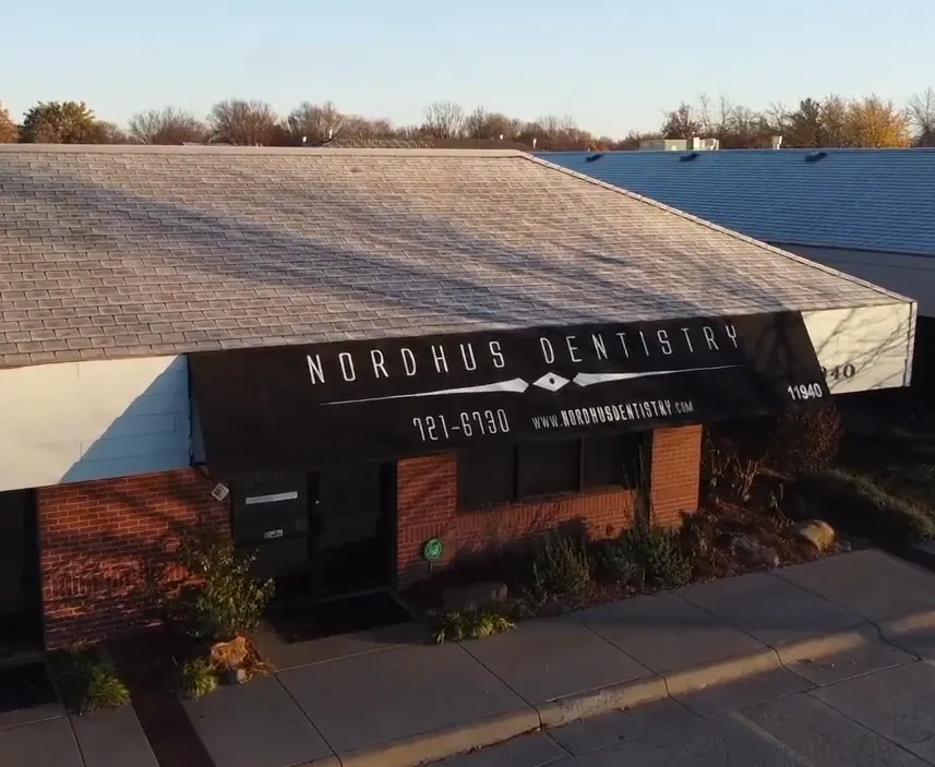 The Nordhus Dentistry building on West Central Avenue in Wichita, seen from above, with its sign over the entrance.
